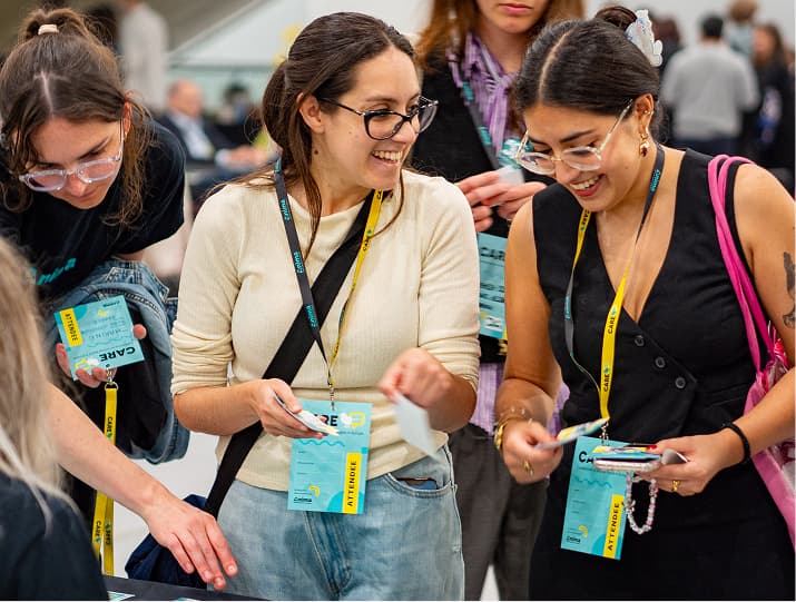 Participants at CARE Conference during a break, talking and laughing